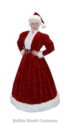 a woman dressed in a red and white santa costume with her hands on her hips