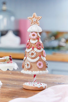 a decorated cookie christmas tree on a table