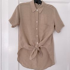 Brand New With Tags, Never Worn. Point Collar And Short Sleeves, Button Placket With Ties At Hem, Curved High-Low Hem. 70%Viscose,30%Linen Classic Neutral Tops For Day Out, Brown Linen Button-up Blouse, Versatile Beige Short Sleeve Blouse, Neutral Button-up Tops For Daywear, Casual Beige Blouse With Buttons, Everyday Collared Blouse In Neutral Color, Casual Neutral Button-up Blouse, Everyday Neutral Collared Blouse, Neutral Buttoned Tops