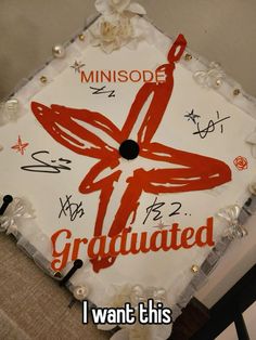 a decorated graduation cap that reads, i want this