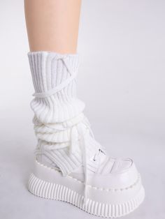 Elevate your Kawaii or Lolita outfit with these charming white/black self-tie straps knitted leg warmers. Made for the fashion-forward individual, these leg warmers feature a versatile color option of white and black, making them easy to pair with a variety of outfits. The knitted construction provides warmth and comfort, while the self-tie straps add a touch of playfulness and customization to your look.   Please note that this product includes only one pair of leg warmers. White Harajuku Knee-high Socks For Winter, Fitted Mid-calf White Leg Warmers, Trendy White Thigh High Leg Warmers, Trendy White Thigh-high Leg Warmers, Harajuku Style White Leg Warmers For Fall, White Knitted Fitted Knee-high Socks, Harajuku Style White Knee-high Leg Warmers, White Harajuku Knee-high Leg Warmers, White Harajuku Style Knee-high Leg Warmers