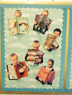 a bulletin board with pictures of children holding books