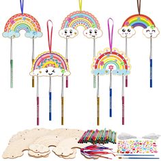 a group of wooden toys with rainbows and clouds on them next to other items