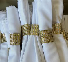 some white napkins with gold beading on them