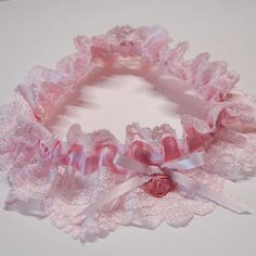 "Lovely vintage pink lace with a nice sheen and detail in the flower bloom pattern has a stitched pink satin ribbon casing for the elasticized gathering. There is a pink satin bow with a pink rose bud accent. This particular garter will stretch between a 14\" and 19\" measurement. Custom orders are available if you need another size just send me a message. This garter is ready to ship." Fitted Pink Lace, Fitted Pink Lace Tops, Elegant Pink Lace For Party, Pink Fitted Lace For Party, Fitted Pink Lace For Party, Fitted Pink Lace For Wedding, Pink Garter, White Garters, Wedding Garter Lace