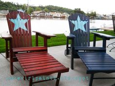 three wooden chairs sitting on top of a patio next to a body of water