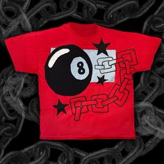 a red t - shirt with a black eight ball on it and stars around the neck