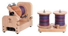 two spools of thread sitting next to each other on a wooden stand with buttons