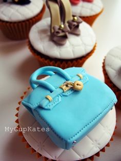 cupcakes decorated with handbags and purses