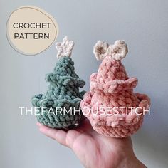 two crocheted christmas trees sitting on top of each other