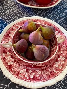 a bowl filled with red onions on top of a table