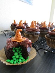 cupcakes with chocolate frosting and candy decorations