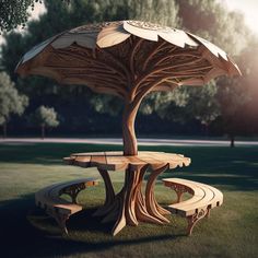 a wooden table and bench in the grass with an umbrella shaped tree on one side