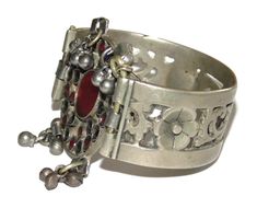 Link to store: https://www.etsy.com/shop/VintageJewelryEden Type: Fantastic Antique Ethnic Middle East Early Century Vintage Estate Hard Cuff Ornate Cut Out Elements with Round Encrusted with little gems and adorned with a cluster of dangling balls Bracelet Gender: Women Metal: Low-level silver Metal Purity: .500 Weight: 54 grams Length: 7 inches Width: 1-inch cuff 2 inches width front round element Defects/Additional info: no defects, one gem appears replaced, but looks to be of the same age as Bohemian Bracelet Jewelry For Celebration, Bohemian Bangle Bracelet For Celebration, Bohemian Bracelets With Intricate Design For Celebrations, Bohemian Silver Bangle For Celebration, Bohemian Silver Bracelet For Celebration, Bohemian Bracelets For Festivals And Celebrations, Bohemian Bangle Bracelets For Celebration, Bohemian Jeweled Bracelets For Festive Occasions, Bohemian Jeweled Bracelet For Festive Occasions