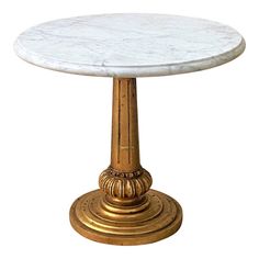 a white marble topped table with gold accents