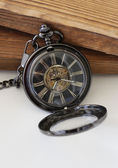 "This pocket watch can be purchase with or without engravings. Engraving will be on back glass of the pocket watch.  Great gift for everyone even yourself ! Our elegant steampunk victoriana pocket watch has elegant carved case design. Diameter of the watch is 1-3/4\". Watch is mechanical, please wind it after arrival. Setting the time You will need to grasp the crown (button at the top) tightly and pull. When you hear a click you will be able to turn the crown/button to set the time. Once you ha Steampunk Pocket Watch, Mechanical Pocket Watch, Groomsmen Gifts Personalized, Wedding Gifts For Groom, Pocket Watch Chain, Wedding Watch, Watch Chain, Groom Gift, Groomsman Gifts