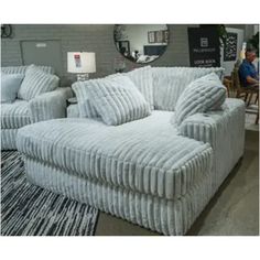 a couch and chair are on display in a store