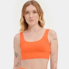 This Ugg Zayley Logo Neon Orange Osrb Bralette Sports Bra Crop Top Is New With Tags. Size: Xs Style No: 112939 Description: Made Of Organic Cotton Blended With Elastane For Flexibility, The Zayley Bralette Is A Go-To Layer For Year-Round Wear. Offering Comfort And Style When You're On The Go, It Pairs Effortlessly With Shorts And Joggers For A Laidback Warm-Weather Look. Tank Top Style Bralette Self - 94% Organic Cotton / 6% Elastane Screen Print Ugg Logo Pairs With Saylor Legging And Rilynn Bik Stretch Orange Sports Bra, Orange Athleisure Sports Bra For Workout, Trendy Sports Bra With Medium Support For Workout, Orange Sporty Sports Bra For Gym, Orange Sports Bra For Yoga In Summer, Trendy Medium Support Sports Bra For Workout, Orange Summer Sports Bra, Summer Yoga Sports Bra In Orange, Trendy Moisture-wicking Sports Bra