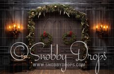 a christmas display with wreaths and lights in front of a wooden door that reads, holiday drops