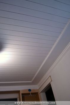 the ceiling is painted white and has some light coming from it