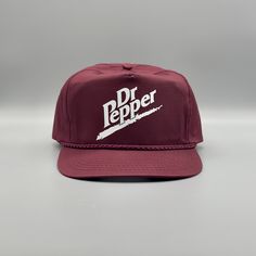 the dr pepper hat is maroon and white