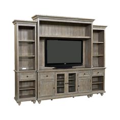 a large entertainment center with a flat screen tv on it's side and shelves