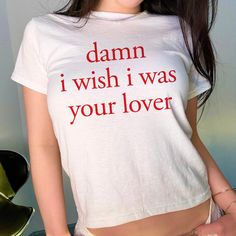 Damn I Wish I Was Your Lover Baby Tee, Aesthetic Baby Tee, Women's Fitted Tee, Unisex Shirt, Trendy Top, Y2K 90s Baby Tee DETAILS - 100% cotton (fiber content may vary for different colors) - tear-away label  SIZING Please find the size chart in the listing photo before purchasing. PLEASE NOTE: Our Baby tee is sized for a youth, reminiscent of the '90s-era shrunken-down T-shirt. This style, popularized by the skater/raver culture of the time, is not to be confused with the modern crop top. The baby tee was the equivalent of a kids' size medium or large and reflected the child-inspired fashion trend of that era. I suggest taking a tee or singlet you already enjoy wearing and measuring it to compare with the dimensions provided size chart in the listing photo, in order to find the ideal size Retro White Tops With Letter Print, Retro Crew Neck Tops With Name Print, Retro Cotton Tops With Name Print, Retro White Slogan Tops, Y2k Style Cotton Tops With Letter Print, Y2k Cotton Tops With Letter Print, Vintage Summer Tops With Funny Text, 90s Style Cotton Tops With Letter Print, Vintage White Tops With Funny Print