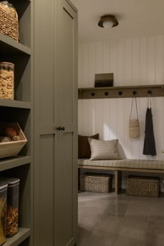 a room that has some shelves with baskets on it and other items in the closet