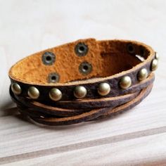 Adjustable Cuff Bracelet With Rivets As Gift, Vintage Adjustable Cuff Bracelet As Fashion Accessory, Vintage Adjustable Cuff Bracelet, Vintage Leather Bracelet With Rivets, Vintage Adjustable Leather Bracelet With Rivets, Adjustable Vintage Leather Bracelet With Rivets, Gold Vintage Leather Bracelet, Vintage Gold Leather Bracelet, Leather Cuffs