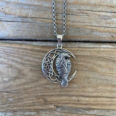 Celtic moon necklace with a Raven......1 1/2" tall with the bail by 1" wide at the widest spot, handmade and antiqued in sterling silver 925...great detail...the chain is 18" long also in sterling silver 925 with a lobster catch Unique Moon-shaped Engraved Necklace, Unique Engraved Moon-shaped Necklace, Unique Moon Shaped Engraved Necklace, Vintage Sterling Silver Moon Phase Necklace, Spiritual Silver Crescent Necklace, Handmade Silver Crescent Necklace, Silver Necklace With Moon Charm, Unique Silver Moon Phase Necklace, Unique Silver Necklace With Moon Charm