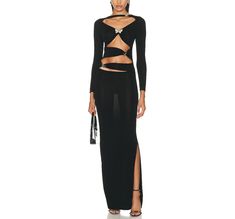 Introducing the Hot Fashionista Dakota Cutout Midi Dress in Black, a daringly chic ensemble designed to command attention and exude confidence with every step. Crafted from luxurious, figure-hugging fabric, this midi dress boasts an alluring silhouette that accentuates curves in all the right places. The timeless black hue adds a touch of sophistication, while strategic cutouts along the bodice and waistline inject a hint of edgy allure. The neckline plunges with understated elegance, drawing the eye upward and elongating the silhouette for a flattering effect. The midi length offers a perfect balance of sophistication and allure, making it suitable for a variety of occasions. Whether you're attending a cocktail party, a night out on the town, or a chic dinner date, the Hot Fashionista Dak Cutout Midi Dress, Exude Confidence, Cami Crop Top, Swimwear Cover Ups, Understated Elegance, Swimwear Cover, Outerwear Sweater, Tank Top Cami, Lingerie Sleepwear