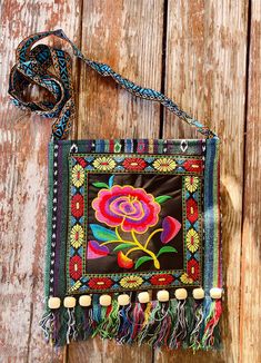 This is a lovely gift for any occasion or to add to your own collection. * Embroidery Design * Wooden Beads to add style * Crossbody * Cambaya and Polyester Fabric * Beautiful Bold Colors * Zipper Closure * Floral Design * Tassels attached at the bottom of bag Handmade Multicolor Embroidered Shoulder Bag As Gift, Bohemian Beaded Shoulder Bag For Gift, Beaded Multicolor Embroidered Rectangular Shoulder Bag, Embroidered Square Shoulder Bag For Gift, Multicolor Embroidered Beaded Rectangular Shoulder Bag, Bohemian Multicolor Embroidery Bags As Gifts, Embroidered Green Shoulder Bag As Gift, Embroidered Green Shoulder Bag For Gift, Bohemian Bag With Floral Embroidery As Gift