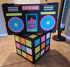 a rubik cube is stacked on top of each other in front of a fan