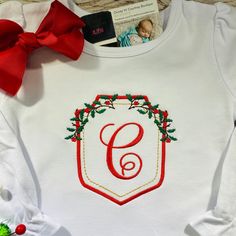 Monogram Christmas Shirt, Christmas Personalized Embroidered Shirt for Boys or Girls, Personalized Christmas Shirt, Christmas Tops, Personalized Shirt Please leave child's initial you want on the shirt.  If you wish for all 3 initials to be added please leave them in first, LAST, middle format.  All shirts will be done on white unless you leave a certain color shirt request  in the note to seller box.   I do not accept returns on custom or personalized items.  Feel free to message me with any qu Christmas Monogram Shirt, Personalized Christmas Shirts, Applique Monogram, Shirt For Boys, Christmas Monogram, Christmas Tops, Cotton Bodysuit, Color Shirt, Personalized Embroidered