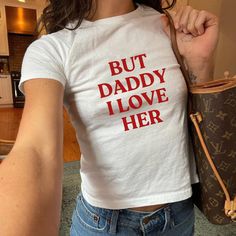 Make a bold statement with our "But Daddy I Love Her" Baby Tee, designed for those who celebrate love in all its forms. This Y2K-inspired pride shirt is a perfect addition to your wardrobe, showcasing support for the lesbian and bisexual communities. Wear it proudly! The fabric is 100% cotton for solid colors. Polyester is included for heather-color variants. These fabrics are prime materials for printing. The shoulders have twill tape for improved durability. The collar is curl resistant due to ribbed knitting. There are no seams along the sides. DETAILS:  *Made with 100%, midweight (5.3 oz/yd² (180 g/m US cotton that feels soft to the touch and a great choice for any season. *The crew neckline along with the tee's classic fit, deliver a timeless style that is perfect for daily use. *All But Daddy I Love Him, Daddy I Love Him, 90s Baby, Y2k Baby Tee, Funny Baby, Baby Tee, I Love Him, Love Him, I Love