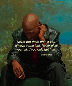 a man sitting on top of a green bench next to a painting with a quote about never put them first, if you always come last