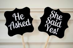 two black and white cupcake toppers with the words she asked, she said yes