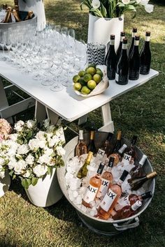 a table topped with lots of bottles and glasses