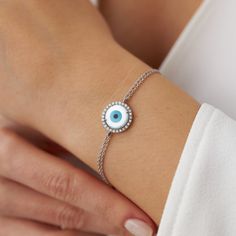 A lovely evil eye design in which the evil eye is accompanied by hand-selected natural diamonds. The double-chain design ensures the safety of the piece so that you can enjoy this piece for many years to come.★ Bracelet Features • Gold Kt: 14K/18K Solid Gold (According to your preference)• Available Gold Colors: Yellow Gold, White Gold, Rose Gold• Total Diamond weight: 0.20 carat• Diamond color: G color VS2/SI1 clarity• We only work with real natural diamonds• We include a signed certificate wit Evil Eye Diamond Jewellery, Fine Jewelry With Evil Eye In White Gold, Fine Jewelry White Gold Evil Eye Jewelry, Fine Jewelry Evil Eye In White Gold, Fine Jewelry White Gold Evil Eye, Silver Diamond Evil Eye Jewelry, Evil Eye Cubic Zirconia Bracelet, Adjustable Round Jewelry With Diamond Eyes, Elegant Round Chain Bracelet With Evil Eye