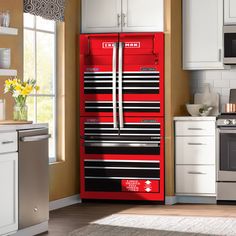 a red toolbox in the middle of a kitchen