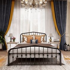 a bed room with a neatly made bed and a chandelier