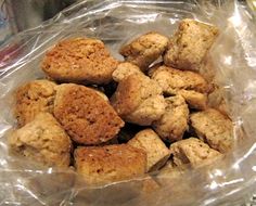 a plastic bag filled with cookies sitting on top of a table