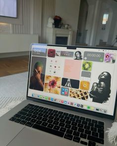 an open laptop computer sitting on top of a bed