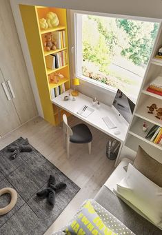 an aerial view of a child's bedroom with toys on the floor and bookshelves