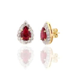 This is part of Chairish’s Fine Jewelry assortment.  Pear Cut Ruby Diamond Halo Studs in 18K Gold. Embrace your look with these stunning pair of earrings suitable for any occasion to complete your outfit. Studs create a subtle beauty while showcasing the colors of the natural precious gemstones and illuminating diamonds making a statement.  PRODUCT DETAILS :-  Material - 18K Solid Yellow Gold Gemstone - Ruby  Gemstone shape - Pear   Gemstone Weight - 1.3 ct Gemstone Size - 6 x 5 mm  Diamond Weight - 0.45 ct  Diamond Size - 1.5 mm  Gross Weight - 3.74 Grm Setting - Prong setting Subtle Beauty, Pink Studs, Opal Earrings Stud, Ruby Diamond, Ruby Gemstone, Modern Earrings, Diamond Halo, Diamond Sizes, Precious Gemstones