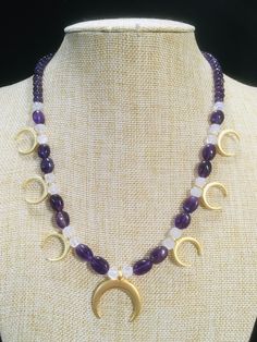 "Ancient style Lunula or Crescent moon necklaces with a variety of genuine gemstone options! Beautiful 22k gold plated pendants to compliment your ancient Roman, Greek, Parthian, Coptic or any other Bronze age persona! You can wear them with your prettiest T shirt and jeans outfit. Earrings that compliment these necklaces can be found in my Etsy shop here. https://www.etsy.com/listing/817662134/ancient-style-lunula-crescent-mooref=shop_home_active_2 These necklaces are finished with 14k gold fil Handmade Celestial Amethyst Necklace, Celestial Crescent Jewelry For Healing, Mystical Crescent Jewelry For Healing, Celestial Amethyst Moon Phase Jewelry, Celestial Moon Phase Amethyst Jewelry, Gold Crescent Gemstone Jewelry, Mystical Crescent Gemstone Necklace, Mystical Crescent Amethyst Jewelry, Spiritual Crescent Jewelry With Natural Stones