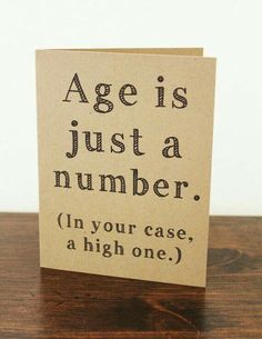 a card with the words age is just a number in black ink on top of it