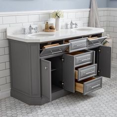 a bathroom vanity with two sinks and three drawers in the middle of it is shown