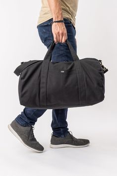 You won’t find a harder-working gym bag than this durable and versatile Aarde Gym Bag for daily outings, outdoor activities, traveling and more! Bag: 11"(H) x 18"(W) x 10"(D) Made with 12 to 14 oz Certified Fairtrade Organic cotton canvas Approximately 32L capacity Main compartment zippers with long pulls Internal zippered hanging pocket sized 8.5” (H) x 8.5” (W) External drop-in pocket 8" (H) x 5" (W) Lead-free YKK metal zippers and fasteners Adjustable strap: up to 44 inches in total Your purc Weekender Bag With Functional Pockets For Daily Use, Functional Shoulder Duffle Bag With Pockets, Functional Duffle Shoulder Bag With Pockets, Outdoor Cotton Bag With Reinforced Handles, Functional Duffle Bag Satchel With Pockets, Functional Duffle Satchel Bag With Pockets, Functional Satchel Duffle Bag With Pockets, Rectangular Weekender Bag For Outdoor, Rectangular Weekender Bag With Pockets For Outdoor