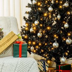 a christmas tree with presents under it